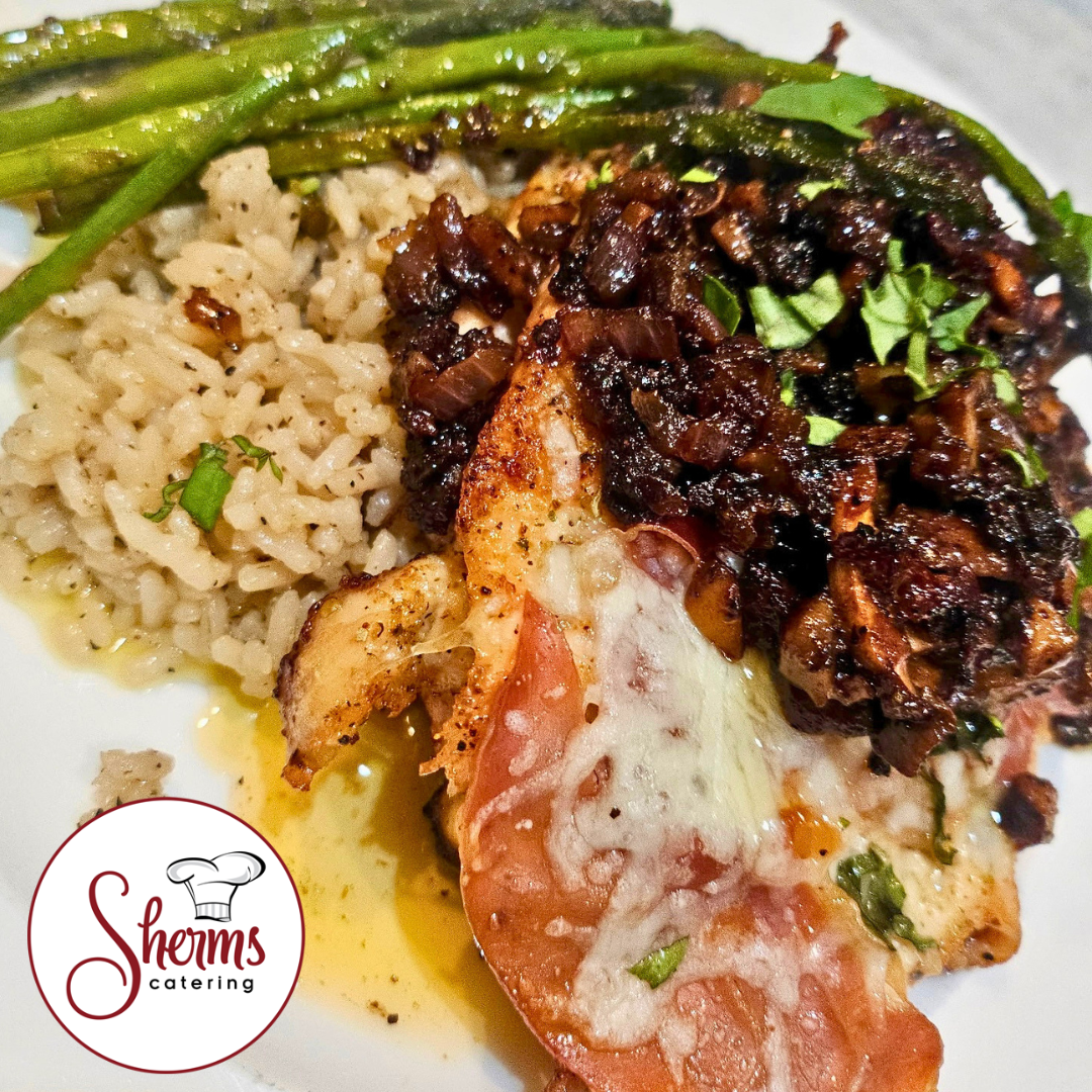 Heat and eat meal with chicken saltimbocca, asparagus, and rice, featuring Sherms Catering logo.